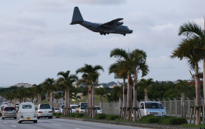 KADENA, JAPAN - FEBRUARY 24: US Air Force C130 aircraft makes a landing approach at the Kadena Air Base on February 24, 2010 in Kadena, Japan. U.S. and Japan will begin talks on Futemma Air Base relocation in early March, following a bilateral agreement originally agreed in 2006 between U.S. and Japan. (Photo by Koichi Kamoshida/Getty Images)