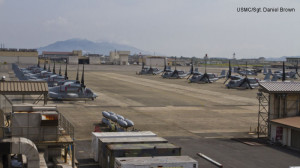 Twelve MV-22 Ospreys sit parked on the tarmac at Marine Corps Air Station Iwakuni here July 24, 2012, after being offloaded from the civilian freight ship, Green Ridge. This marks the first MV-22 Osprey aircraft deployment to Japan and a milestone in the Marine Corps' process of replacing CH-46E helicopters with the MV-22 Osprey, a highly-capable, tilt-rotor aircraft which combines the vertical capability of a helicopter with the speed and range of a fixed-wing aircraft.